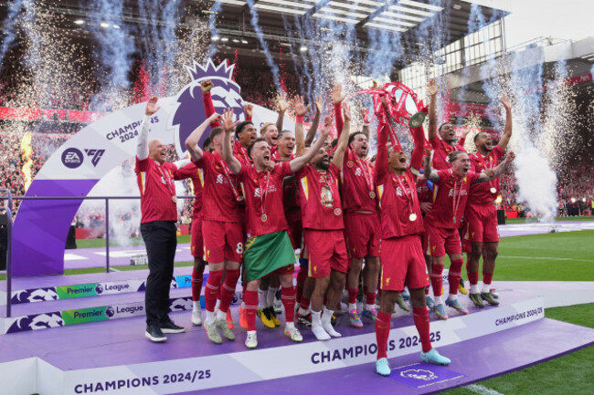 liverpool-players-celebrate-with-the-winners-trophy-after-the-english-premier-league-soccer-match-between-liverpool-and-crystal-palace-at-the-anfield-stadium-in-liverpool-england-sunday-may-25-20