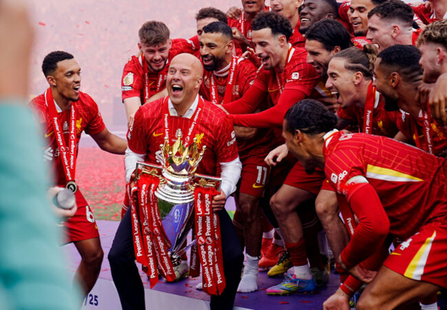 liverpool-manager-arne-slot-lifts-the-premier-league-trophy-with-the-players-after-the-premier-league-match-at-anfield-liverpool-picture-date-sunday-may-25-2025