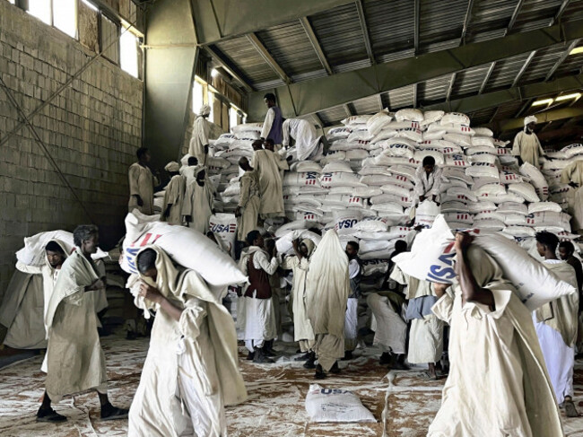 grains-are-transported-by-the-world-food-programme-wfp-from-a-warehouse-to-trucks-carrying-aid-to-the-capital-khartoum-in-port-sudan-eastern-sudan-on-may-3-2025-the-fighting-between-the-sudanese