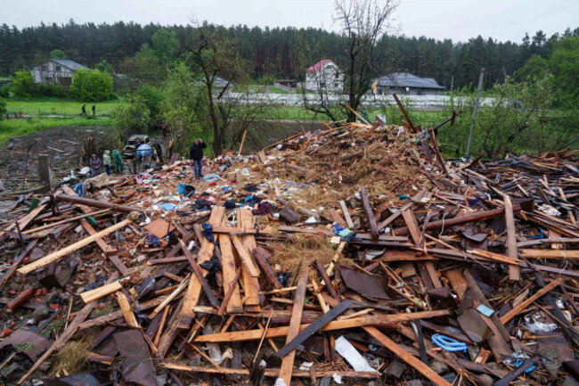 a-man-stands-on-the-rubble-of-a-destroyed-house-where-three-children-were-killed-by-a-russian-strike-in-korostyshiv-zhytomyr-region-ukraine-sunday-may-25-2025-ap-photoevgeniy-maloletka
