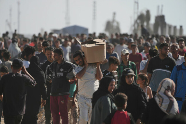 palestinians-carry-boxes-containing-food-and-humanitarian-aid-packages-delivered-by-the-gaza-humanitarian-foundation-a-u-s-backed-organization-approved-by-israel-in-rafah-southern-gaza-strip-on-t