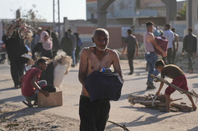 palestinians-carry-boxes-containing-food-and-humanitarian-aid-packages-delivered-by-the-gaza-humanitarian-foundation-a-u-s-backed-organization-approved-by-israel-in-rafah-southern-gaza-strip-on-t