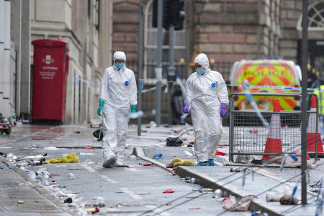 forensic-officers-examine-the-site-where-a-53-year-old-british-man-plowed-a-minivan-into-a-crowd-of-liverpool-soccer-fans-who-were-celebrating-the-citys-premier-league-championship-monday-injuring-m