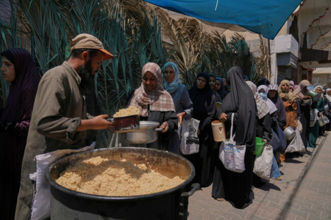 palestinian-women-get-food-at-a-food-distribution-kitchen-in-deir-al-balah-gaza-strip-friday-may-30-2025-ap-photoabdel-kareem-hana