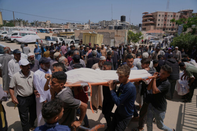 palestinians-carry-the-body-of-a-person-who-was-killed-as-they-were-heading-to-a-gaza-aid-hub-during-a-funeral-at-the-nasser-hospital-in-khan-younis-southern-gaza-strip-sunday-june-1-2025-ap-ph