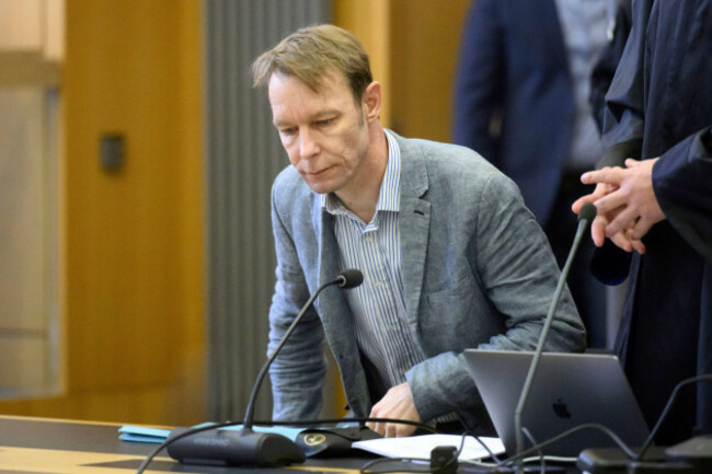 a-man-identified-by-media-as-christian-brueckner-sits-in-the-courtroom-during-his-trial-at-braunschweig-regional-court-in-brunswick-germany-wednesday-april-3-2024-the-accused-faces-three-counts