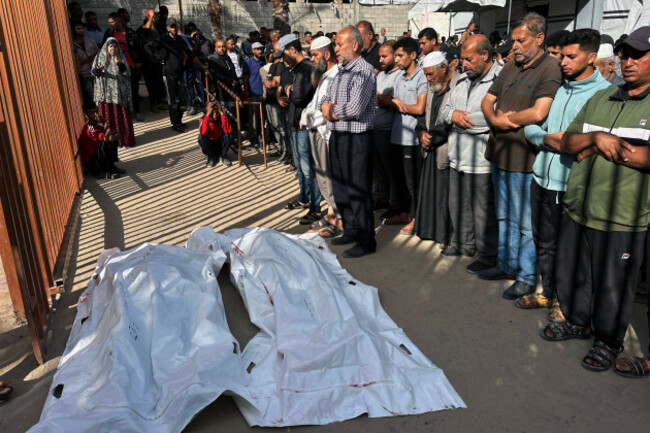 palestinians-mourn-by-the-bodies-of-relatives-who-were-killed-by-israeli-fire-as-they-gathered-near-a-us-backed-aid-center-at-the-nasser-hospital-palestinians-mourn-by-the-bodies-of-relatives-who-wer
