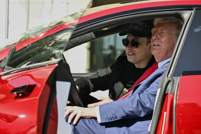 file-president-donald-trump-and-tesla-ceo-elon-musk-speak-to-reporters-as-they-sit-in-a-red-model-s-tesla-vehicle-on-the-south-lawn-of-the-white-house-march-11-2025-in-washington-pool-via-ap-f