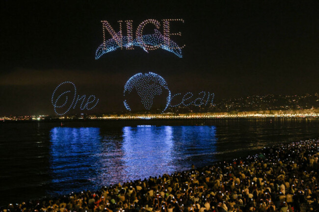 nice-france-france-6th-june-2025-spectators-watch-a-free-drone-light-show-with-a-world-dolphins-and-one-ocean-and-nice-written-in-the-sky-over-the-quai-des-atats-unis-in-nice-marking-the-lead