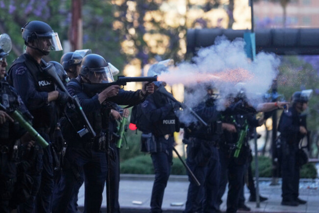 a-police-officer-fires-a-soft-round-near-the-metropolitan-detention-center-of-downtown-los-angeles-sunday-june-8-2025-following-last-nights-immigration-raid-protest-ap-photoeric-thayer