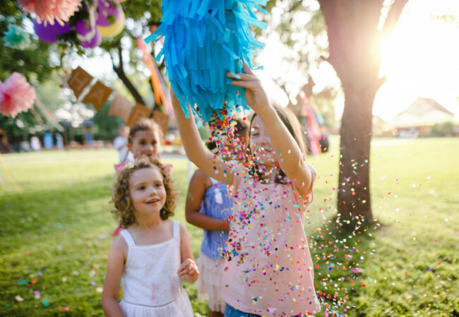 small-children-outdoors-in-garden-in-summer-playing