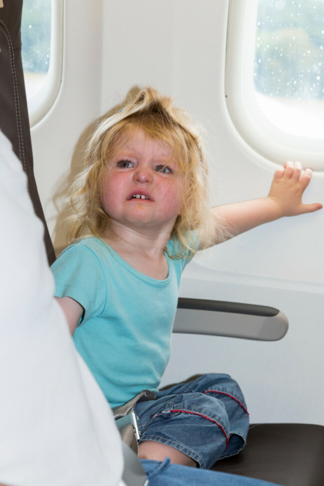 baby-toddler-child-age-two-with-tantrum-going-on-holiday-vacation-flying-on-airbus-air-plane-airplane-aeroplane-flight
