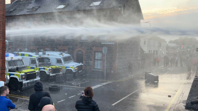 screengrab-taken-from-pa-video-of-police-officers-using-a-water-cannon-near-clonavon-terrace-ballymena-as-people-take-part-in-a-protest-over-an-alleged-sexual-assault-in-the-co-antrim-town-police-u