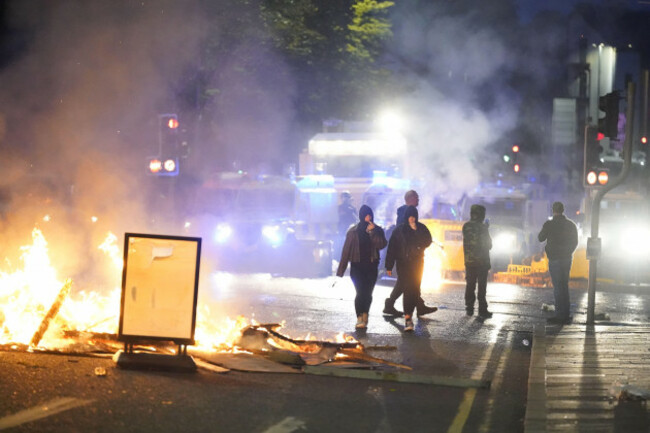 people-take-part-in-a-protest-over-an-alleged-sexual-assault-in-the-co-antrim-town-of-ballymena-police-used-water-cannon-to-disperse-protesters-engaged-in-serious-disorder-for-a-second-night-in-bally