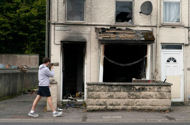 a-burnt-out-house-on-queen-street-following-a-second-night-of-violence-in-ballymena-during-a-protest-over-an-alleged-sexual-assault-in-the-co-antrim-town-multiple-cars-and-properties-were-set-on-fir