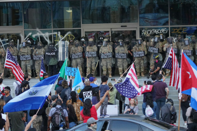 los-angeles-california-usa-10th-june-2025-protestors-gather-outside-the-federal-building-while-california-national-guard-stand-outside-the-building-during-the-demonstration-in-los-angeles-ongoi