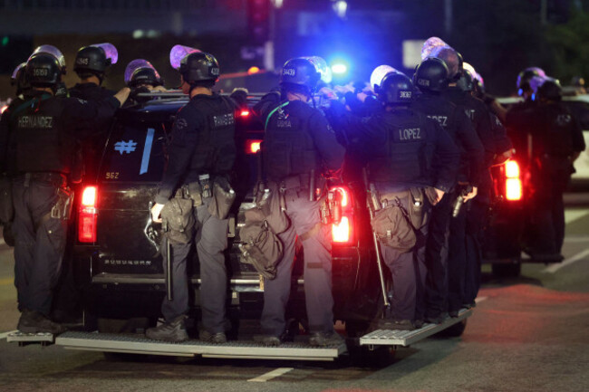 los-angeles-metro-police-ride-on-a-vehicle-during-a-protest-on-wednesday-june-11-2025-in-los-angeles-ap-photoethan-swope