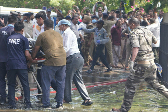 eds-note-graphic-content-rescuers-carry-the-body-of-a-victim-of-an-airplane-that-crashed-in-indias-northwestern-city-of-ahmedabad-in-gujarat-state-thursday-june12-2025-ap-photoajit-solanki