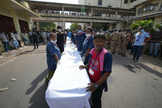 workers-of-civil-hospital-wait-to-receive-remains-of-victims-of-an-airplane-that-crashed-in-indias-northwestern-city-of-ahmedabad-in-gujarat-state-thursday-june-12-2025-ap-photoajit-solanki