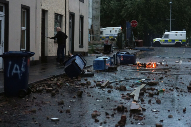 a-resident-clearing-debris-portadown-in-co-armagh-following-three-nights-of-disorder-in-ballymena-co-antrim-picture-date-thursday-june-12-2025