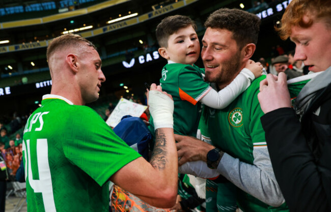 killian-phillips-signs-an-autograph-for-a-fan-after-the-game