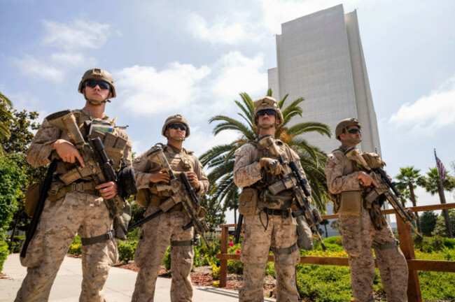 los-angeles-california-usa-13th-june-2025-u-s-marines-stand-guard-outside-of-a-federal-building-a-federal-appeals-court-ruled-on-june-12-that-the-trump-administration-can-maintain-control-of-the