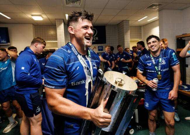 dan-sheehan-drinks-out-of-the-urc-trophy-in-the-dressing-room-after-the-game