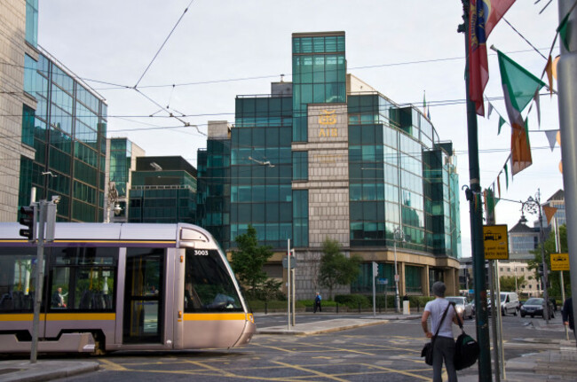 a-luas-tram-passes-in-front-of-aib-headquarters-allied-irish-bank-in-the-city