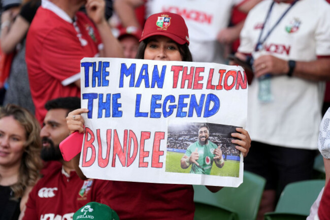a-british-and-irish-lions-fan-hold-up-a-sign-for-british-and-irish-lions-bundee-aki-during-the-lions-1888-cup-match-at-the-aviva-stadium-in-dublin-ireland-picture-date-friday-june-20-2025