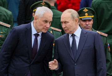 russian-president-vladimir-putin-right-speaks-with-russian-defense-minister-andrei-belousov-during-a-wreath-laying-ceremony-marking-the-84th-anniversary-of-the-nazi-german-invasion-into-soviet-union