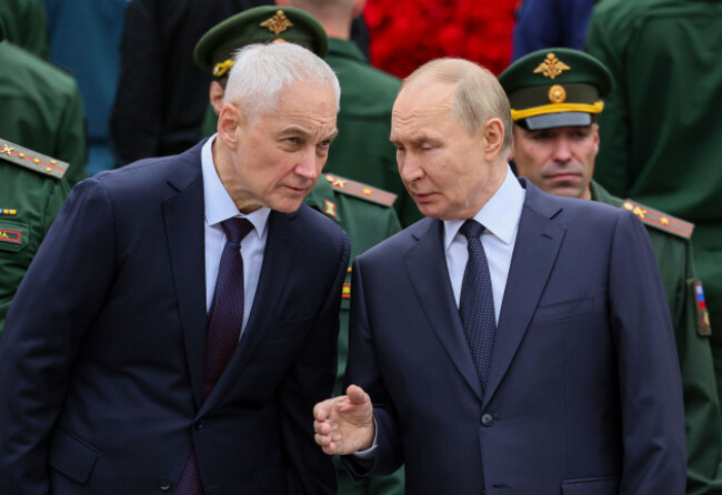russian-president-vladimir-putin-right-speaks-with-russian-defense-minister-andrei-belousov-during-a-wreath-laying-ceremony-marking-the-84th-anniversary-of-the-nazi-german-invasion-into-soviet-union