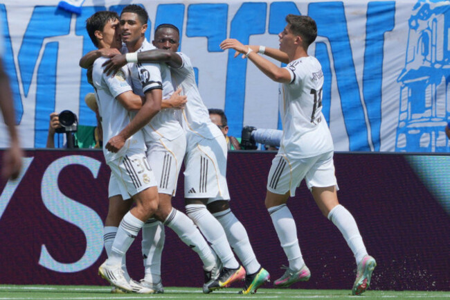 real-madrids-jude-bellingham-center-is-congratulated-after-scoring-his-sides-first-goal-against-pachuca-during-the-club-world-cup-group-h-soccer-match-between-real-madrid-and-cf-pachuca-in-charlot