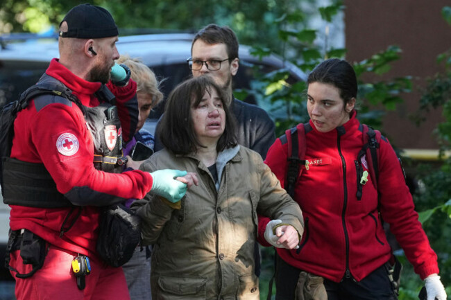 medical-workers-help-a-woman-in-a-yard-of-an-apartment-building-destroyed-after-a-russian-attack-in-kyiv-ukraine-early-monday-june-23-2025-ap-photoefrem-lukatsky