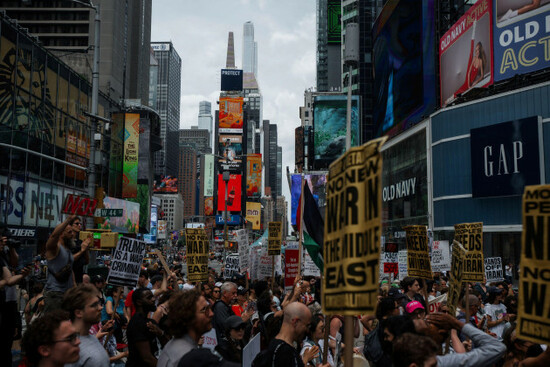 protesters-carry-signs-during-a-protest-against-u-s-strikes-on-iran-sunday-june-22-2025-in-new-york-ap-photoolga-fedorova
