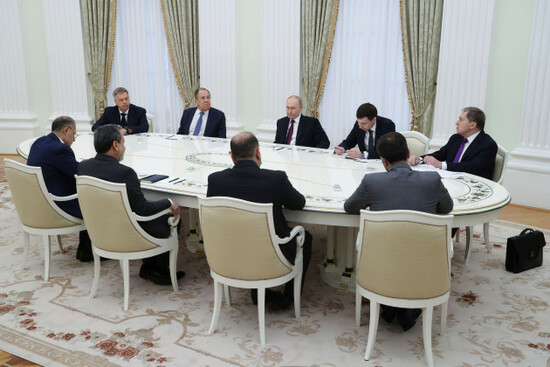 russian-president-vladimir-putin-back-ground-center-and-iranian-foreign-minister-abbas-araghchi-second-left-back-to-a-camera-attend-the-talks-at-the-kremlin-in-moscow-russia-monday-june-23-202
