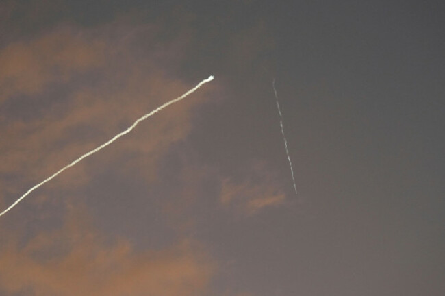 a-smoke-trail-from-the-israeli-iron-dome-air-defense-system-streaks-across-the-sky-as-it-intercepts-missiles-launched-during-an-iranian-attack-as-seen-from-haifa-israel-early-tuesday-june-24-2025