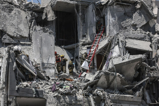 june-24-2025-beer-sheva-beer-sheva-israel-israeli-rescue-teams-operate-at-the-scene-of-a-missile-strike-on-a-residential-area-in-beer-sheva-southern-israel-24-june-2025-according-to-the-isr