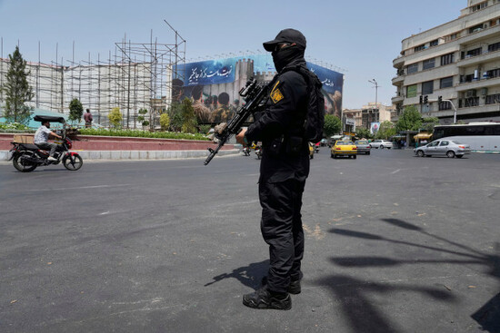 a-member-of-irans-revolutionary-guard-stands-guard-at-enqelab-e-eslami-islamic-revolution-square-in-downtown-tehran-iran-tuesday-june-24-2025-ap-photovahid-salemi