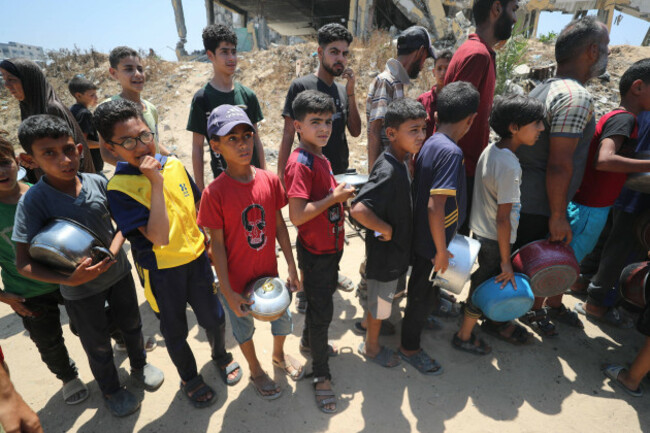 palestinians-wait-for-food-at-a-distribution-point-in-gaza-city-palestinians-wait-for-food-at-a-distribution-point-in-gaza-city-on-june-14-2025-israel-has-faced-growing-condemnation-over-the-humani