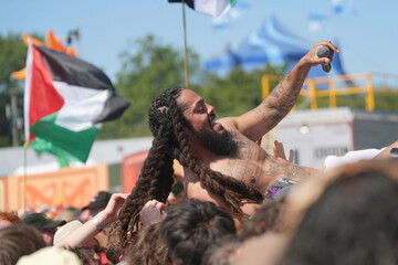previously-unissued-photo-dated-2862025-of-bob-vylan-crowd-surfs-during-his-performance-on-the-west-holts-stage-during-the-glastonbury-festival-at-worthy-farm-in-somerset-the-performer-led-crowds