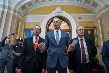 senate-majority-leader-john-thune-r-s-d-is-flanked-by-sen-john-barrasso-r-wyo-the-gop-whip-left-and-finance-committee-chairman-mike-crapo-r-idaho-speaks-to-reporters-just-after-passage-of-t