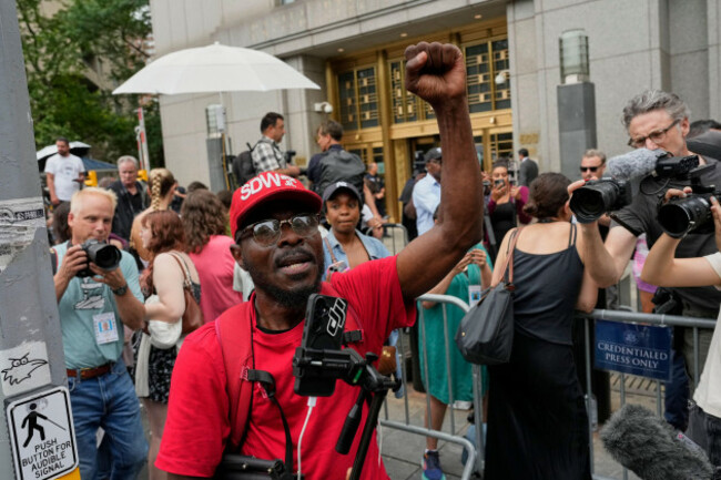 a-supporter-of-sean-diddy-combs-reacts-outside-manhattan-federal-court-after-combs-was-convicted-of-a-prostitution-related-offense-but-acquitted-on-the-most-serious-charges-at-his-new-york-trial