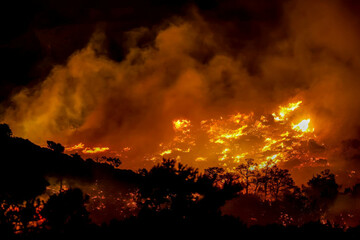 fire-burns-in-the-ahlia-area-near-the-port-town-of-ierapetra-on-the-south-coast-of-crete-island-greece-late-wednesday-july-2-2025-prompting-the-evacuation-of-villages-and-hotels-in-the-region-au