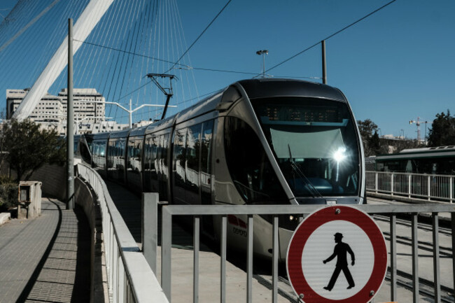 jerusalem-israel-4th-february-2019-a-tram-on-jerusalems-red-line-descends-the-calatrava-chords-bridge-the-jerusalem-district-planning-and-building-committee-gave-a-green-light-to-new-light-rai