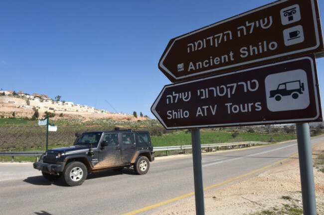 a-sign-points-to-israeli-tourists-sites-and-activities-in-the-jewish-settlement-shilo-west-bank-january-31-2019-amnesty-international-released-a-report-calling-on-airbnb-booking-com-expedia-and