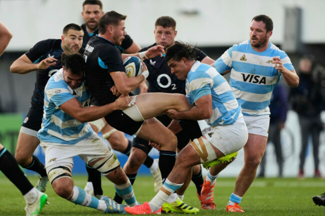 englands-freddie-steward-center-is-tackled-by-argentinas-pablo-matera-right-and-lucas-paulos-during-a-rugby-test-match-in-la-plata-argentina-saturday-july-5-2025-ap-photogustavo-garello
