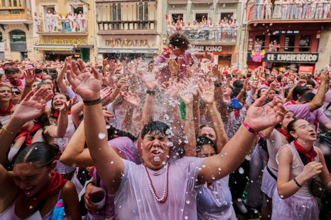 revellers-cool-off-with-water-thrown-from-balconies-during-the-start-of-nine-days-of-uninterrupted-partying-in-pamplonas-famed-running-of-the-bulls-festival-in-pamplona-spain-sunday-july-6-2025