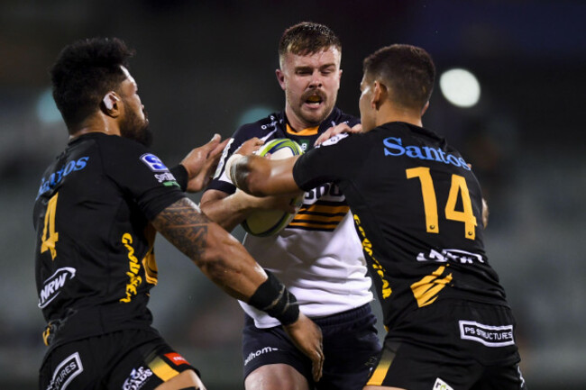 mack-hansen-of-the-brumbies-centre-is-tackled-by-byron-ralston-of-the-western-force-during-the-round-6-super-rugby-match-between-the-act-brumbies-and-western-force-at-gio-stadium-in-canberra-friday