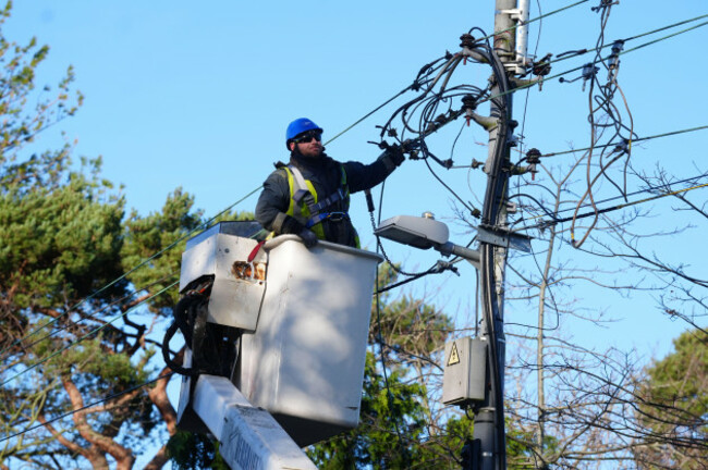 esb-networks-crew-working-to-restore-power-in-avoca-avenue-in-blackrock-co-dublin-after-storm-eowyn-left-one-person-dead-more-than-a-million-people-without-power-and-caused-significant-travel-disru