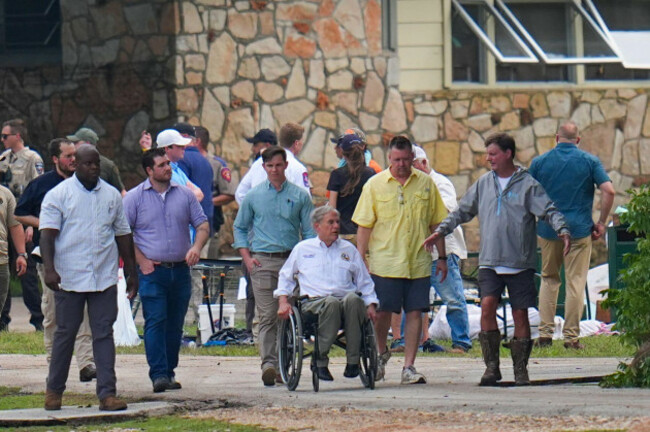texas-gov-greg-abbott-center-tours-camp-mystic-along-the-banks-of-the-guadalupe-river-after-a-flash-flood-swept-through-the-area-saturday-july-5-2025-in-hunt-texas-ap-photojulio-cortez